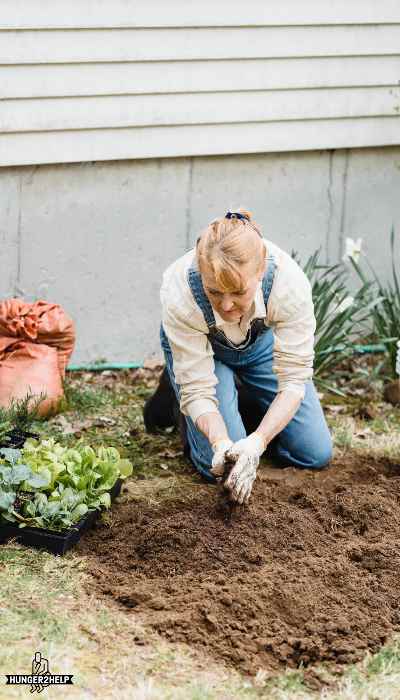 Woman sit near a soil