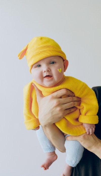 Baby in yellow dress