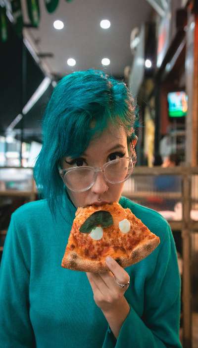 A girl eating pizza